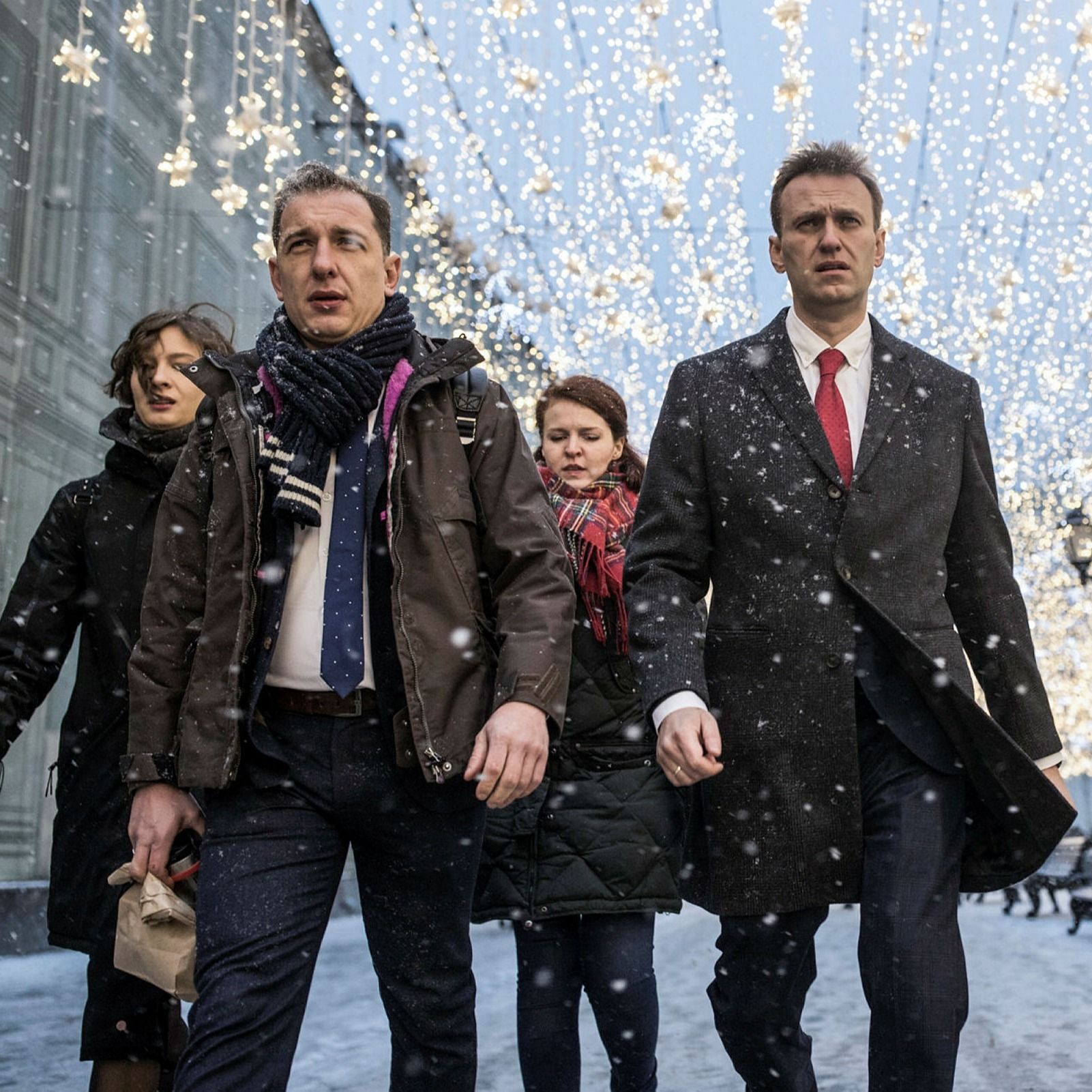 Alexei Navalny, centre, heads to attend a meeting of Russia’s Central Election commission in Moscow in 2017